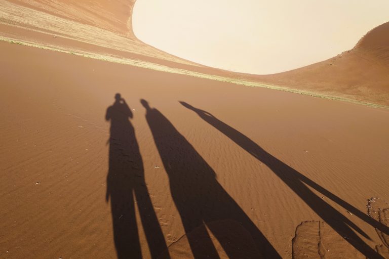 Me and my two German friends casting giant shadows over a 300m+ sand slope. We'd later run down this to the bottom, which was much fun. (Going down >> going up when it comes to sand and prob a few other things.)