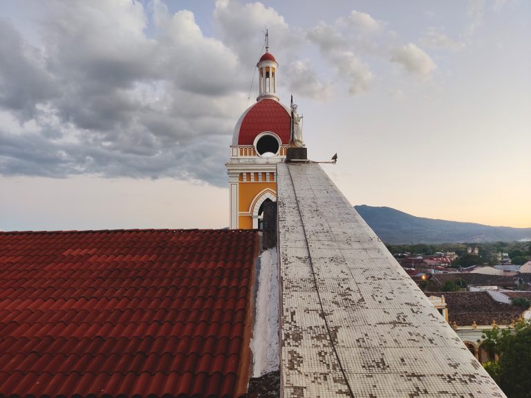 Atop the cathedral with the volcano in the background. We'd already befriended another backpacker just by walking between the two churches, so that + the architecture told me that I'd fall hard for this city!