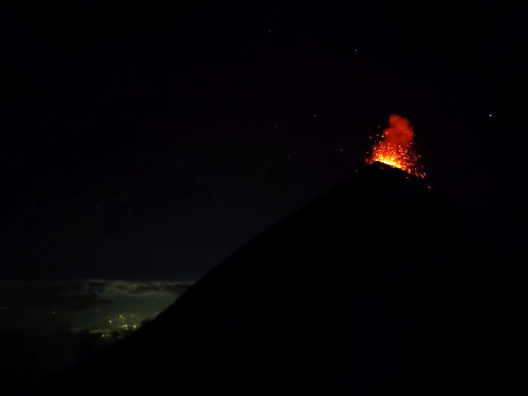 This part of the hike was a little poorly-organised tbf, though the last-minute change of plans were instigated by people in the group rather than the guides. We set out for Fuego much later than everybody else, around 6:30pm iirc, so we spent most of this hike in the dark. It's FAR more challenging than the initial base camp ascent (steep inclines and declines, scree that compounds the challenge). You first descend Acatenango and then ascend Fuego, where the foot traffic at this point was insane (most groups were hours ahead of us, so were leaving as we were arriving). Cue unnecesarily long wait times in the freezing cold and the dark. But eventually, you're rewarded with this scene.
