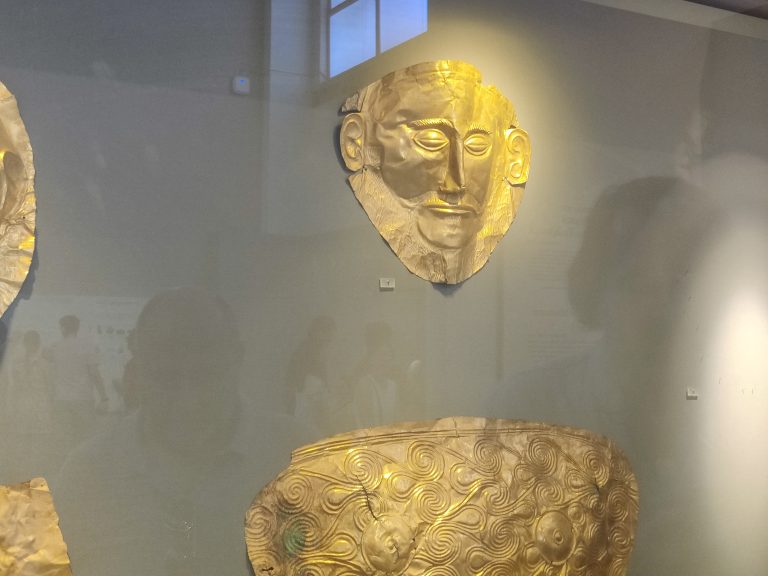 Wiki: "The Mask of Agamemnon is a gold funerary mask which was discovered at the Bronze Age site of Mycenae in southern Greece. The mask, displayed in the National Archaeological Museum of Athens, has been described by the historian Cathy Gere as the "Mona Lisa of prehistory" ... Modern archaeological research suggests that the mask dates to about the 16th century BC, pre-dating the period of the mythical Trojan War by 300–400 years."

Sadly, it was impossible to get a good shot face-on due to the reflective glass, so this is the best I managed. Incredible to see it in person.