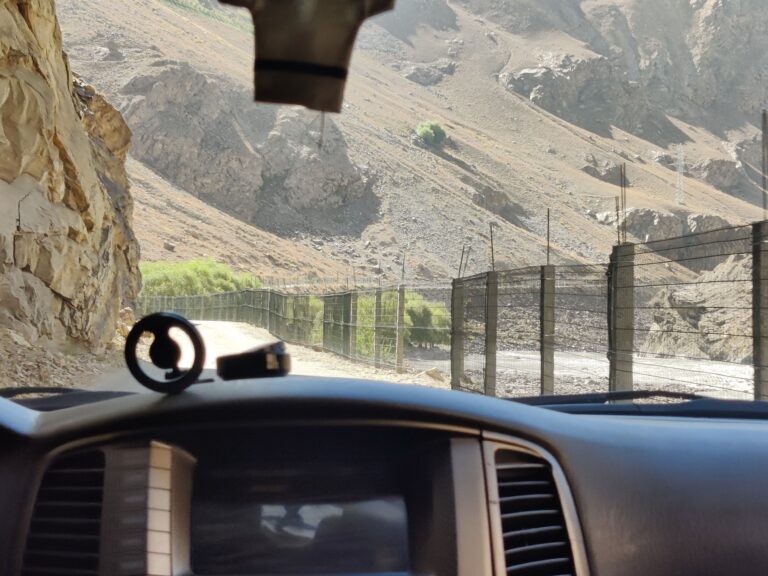 The REAL excitement began from day three, as we continued deeper alongside Afghanistan's Wakhan Corridor - an incongruous strip of land that barely separates Tajikistan from nearby Pakistan (whose mountains we saw from the highway later on). Note the fences demarcating the Tajik border, a common sight during these early days.