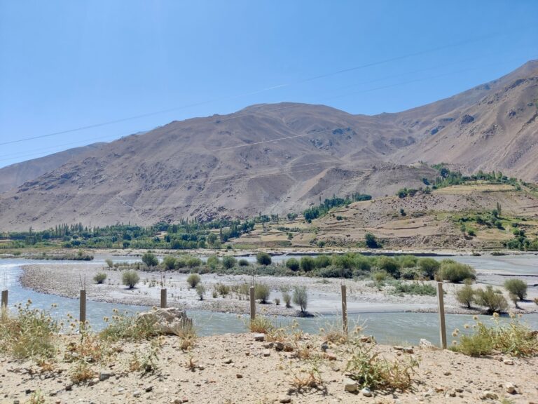 An example of both the intended-but-not-yet-existent fencing, as well as a glimpse of how lush Afghanistan can be on the other side of the river. Not as resplendently green as some of the villages from the day prior when I was sleeping, but about as good as it would get this deep into the Pamirs.