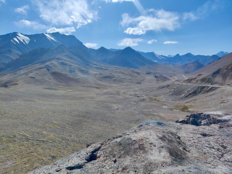 The Pamir Highway to a T. Epic mountains, miles and miles of emptiness, and a sense of wonder through it all.