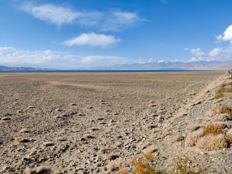 In the distance: our final stop in Tajikistan. Lake Karakul, and the small town on its shores.